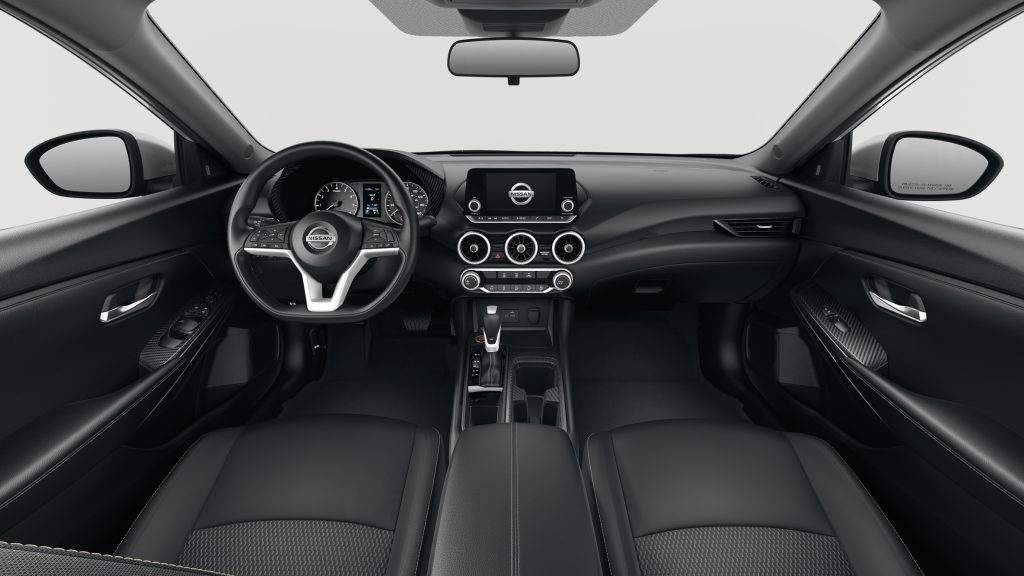 Modern and stylish interior of the 2025 Nissan Sentra featuring a sleek dashboard, ergonomic steering wheel, and advanced touchscreen display.